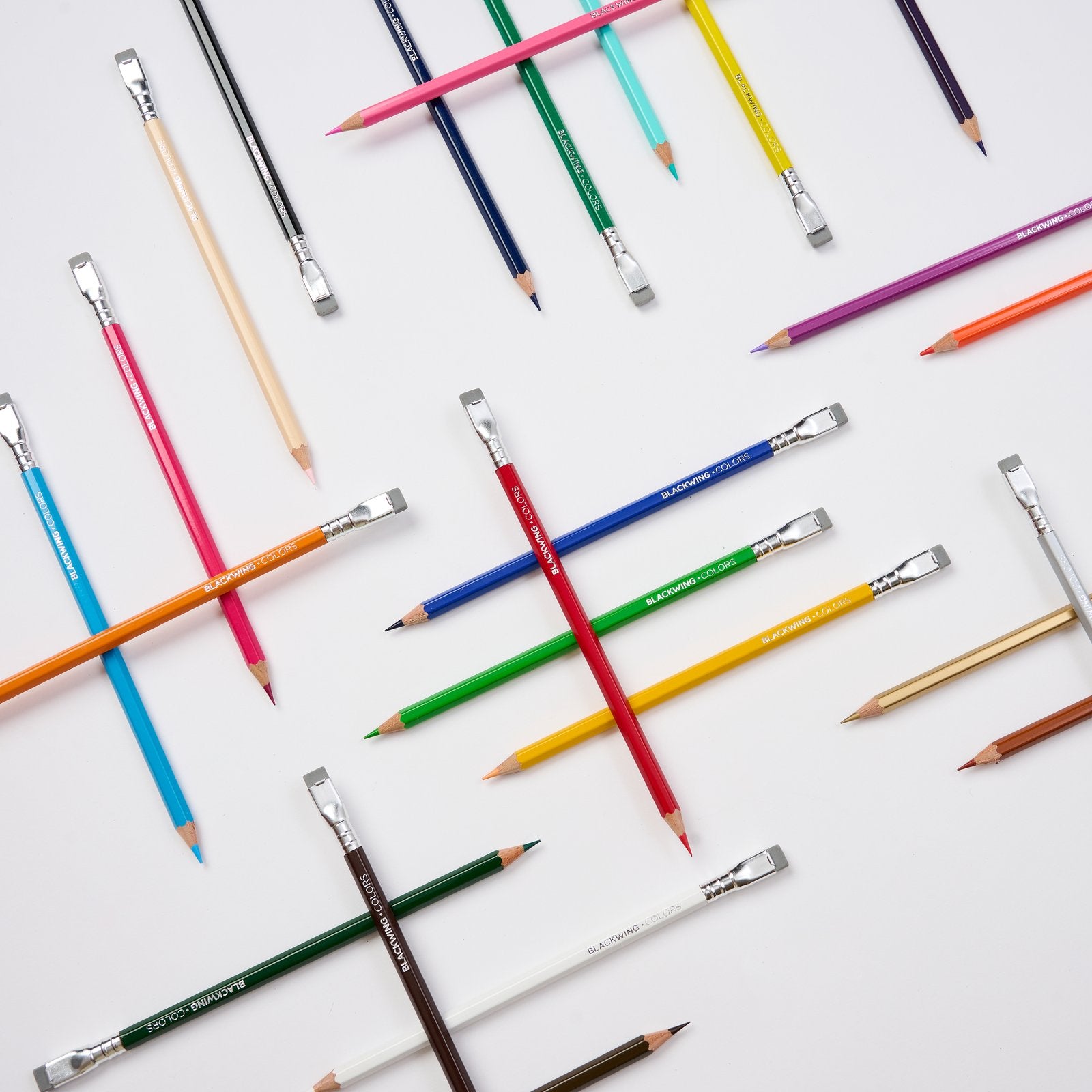 Blackwing Colors pencils in assorted colours laid out on a white background.