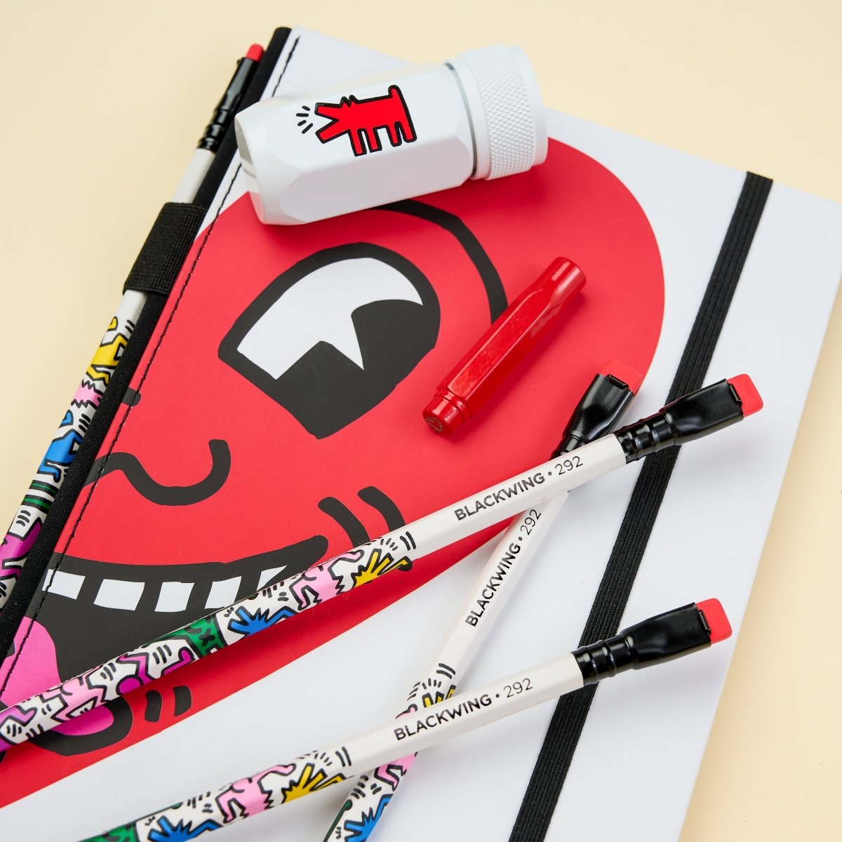 Close-up of the Blackwing pencils featuring colourful Keith Haring-inspired designs.