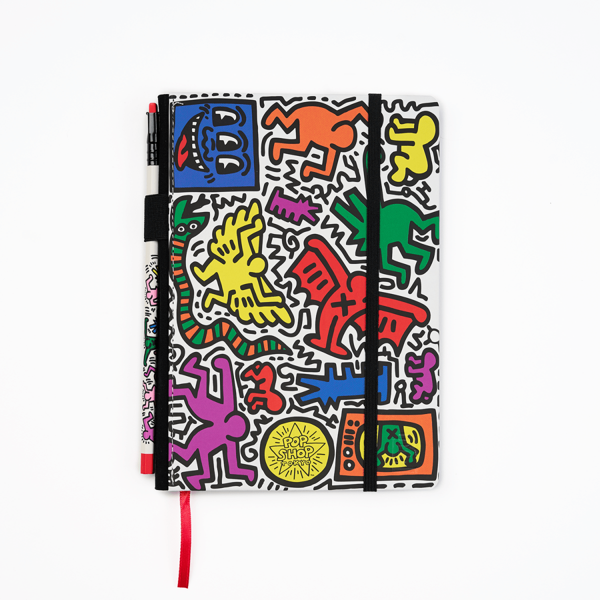 Front view of the Keith Haring “Tokyo Pop-Shop” notebook with a vibrant, multi-coloured cover featuring Haring’s iconic artwork.