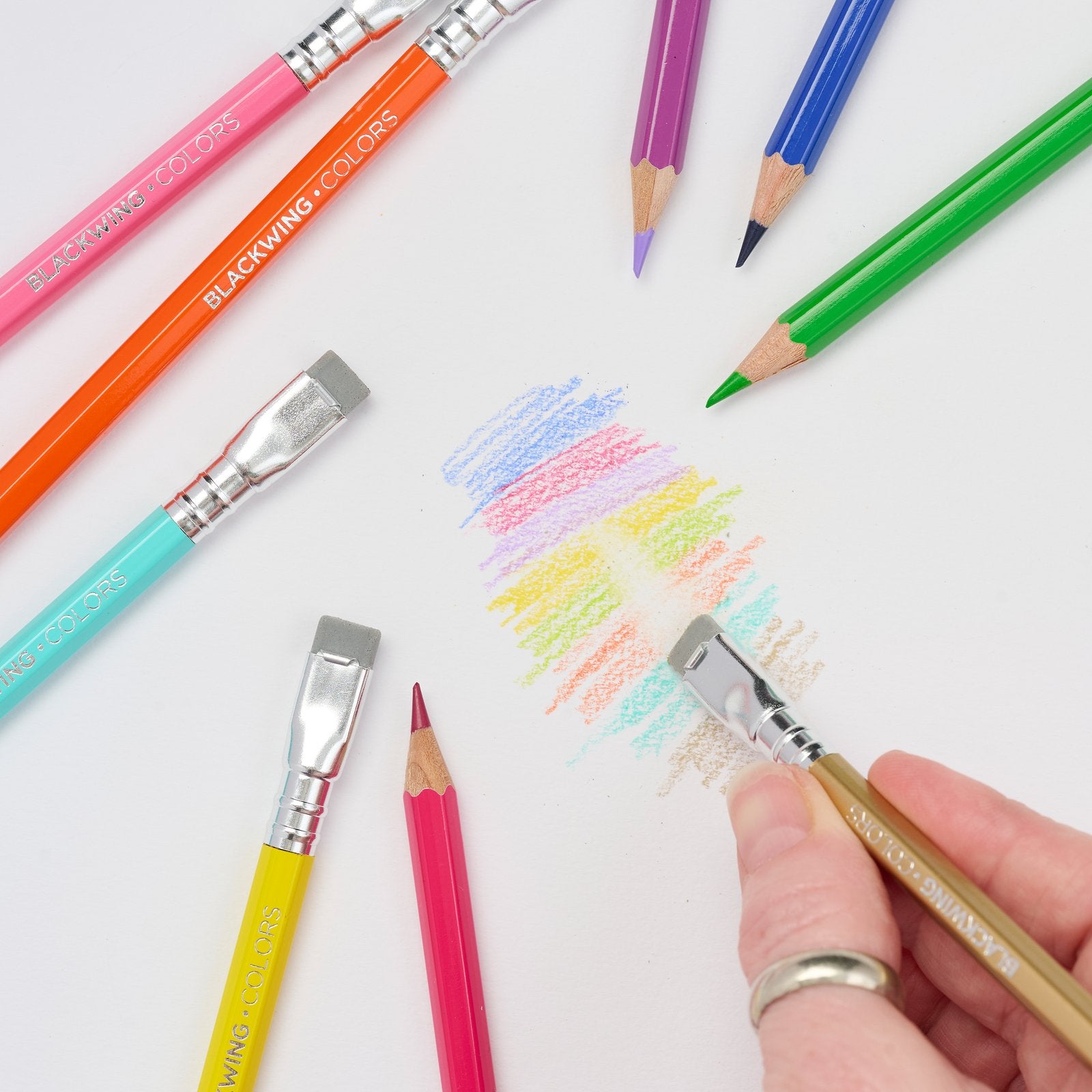 Blackwing Colors sand eraser lifting colour from a swatch on white paper.