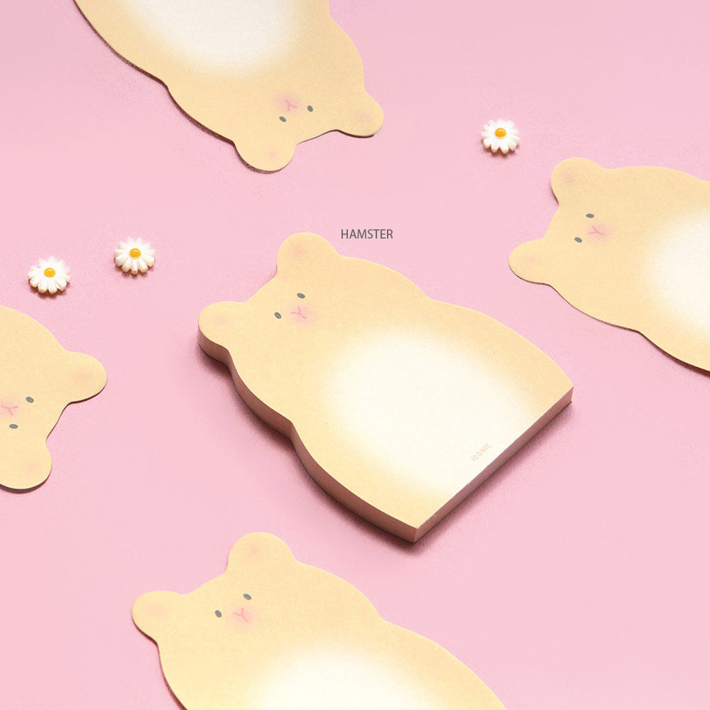 Iconic Animal Memo Pads in animal shapes laid on a pastel pink background beside small decorative items.