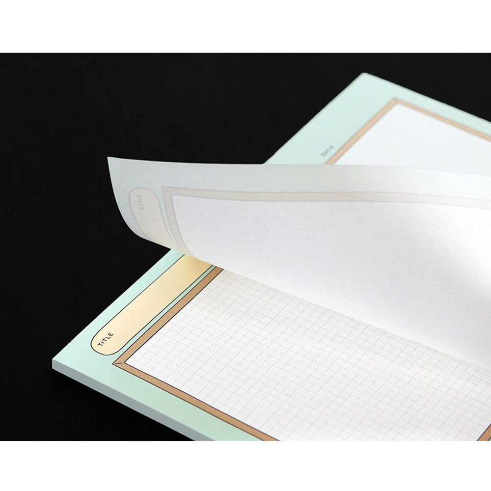 Iconic B5 Blah Blah Memo Notepad open showing perforated tear-off pages for easy note removal.