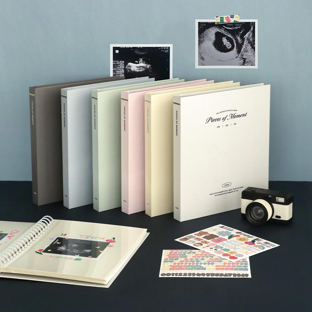 Iconic Collect Self-Adhesive Photo Album 25 sheets in assorted pastel colours displayed with printed photos and camera.