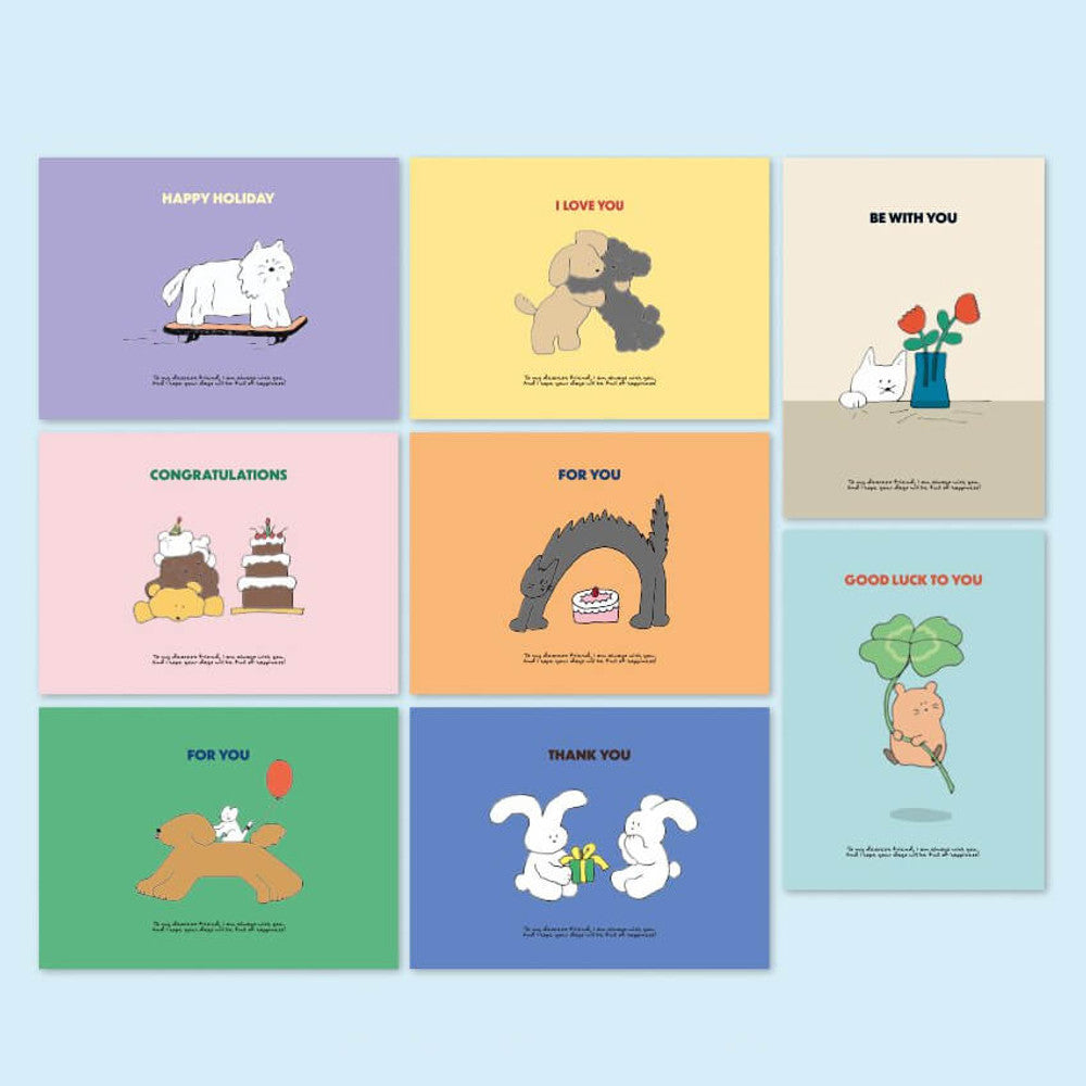 Iconic Cuddly Message Cards in various pastel colours with dog and cat designs displayed on desk.
