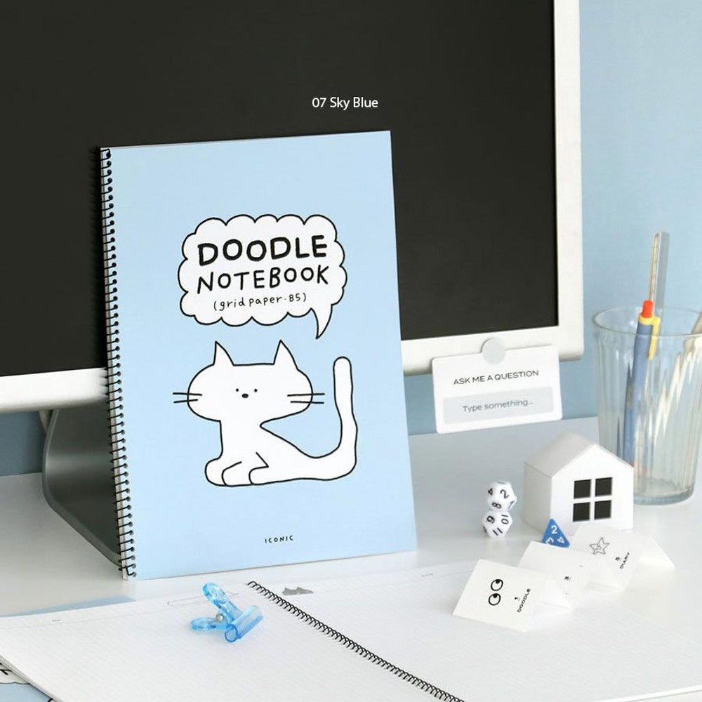 Iconic Doodle B5 Grid Notebook in blue covers shown with matching doodle-themed stationery.