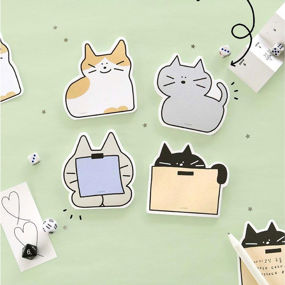 Iconic doodle cat memo pads in playful cat shapes on green desk background
tear-off cat sticky notes in assorted colours and designs.