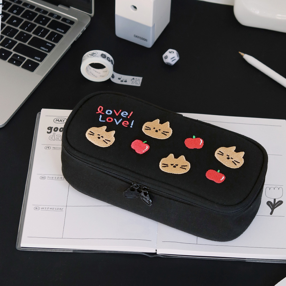 Iconic Doodle Printed Large Capacity Pen Case in black color displayed on desk with office accessories.