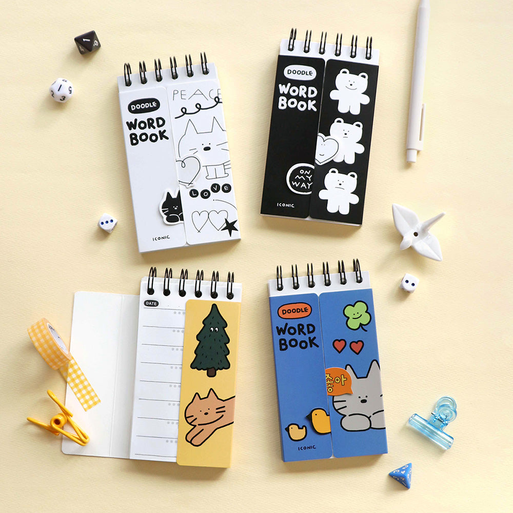 A set of Iconic Doodle Word Compact Size Notebooks displayed on a desk.