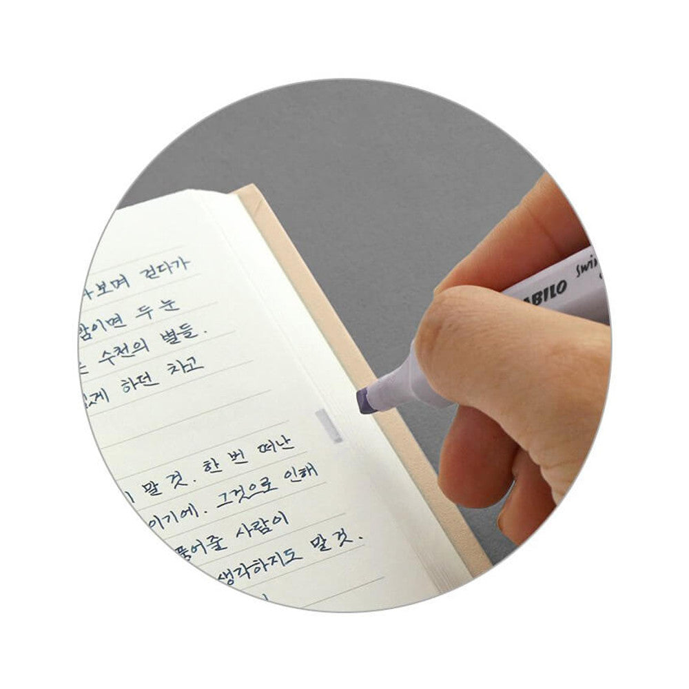 Iconic Solitude Tomoe River Line Notebook page detail showing smooth paper and clear ruling.
